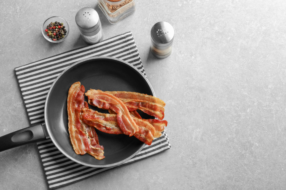 Is Bacon Good for Weight Loss? A plate of crispy bacon strips