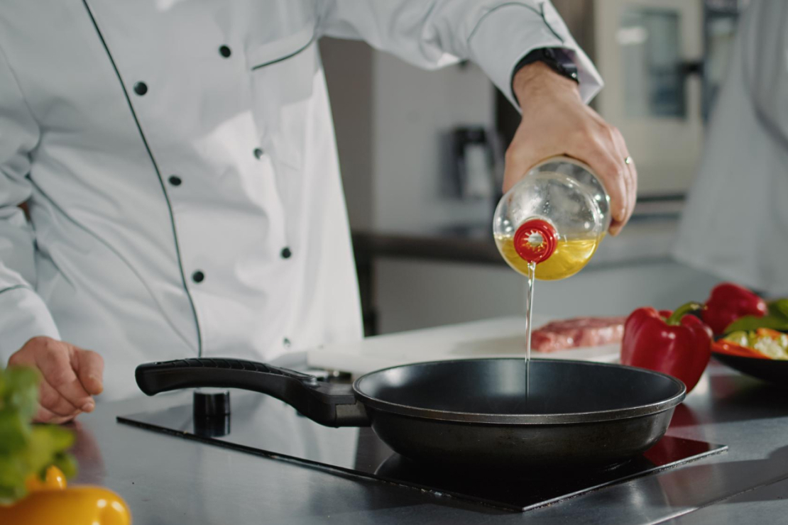 A vibrant display of olive oil, coconut oil, and avocado oil, symbolizing healthy fat choices for cooking.